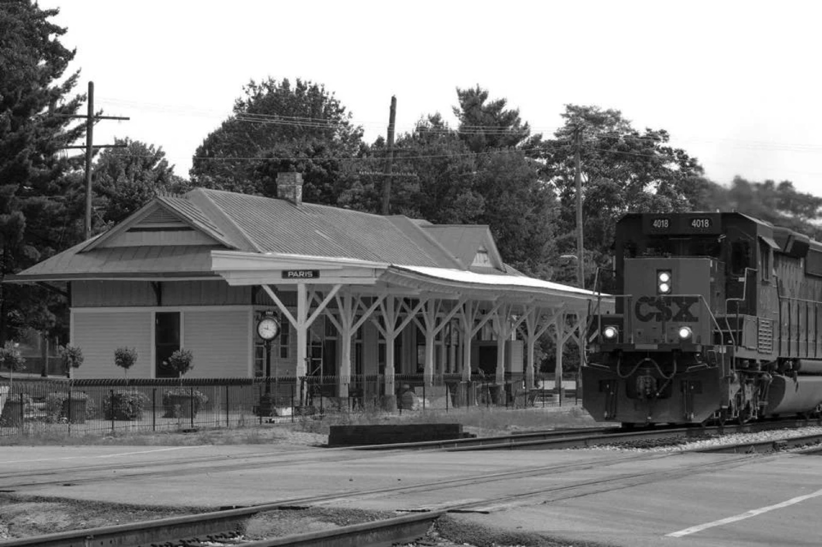 Current view of the Paris Train Depot with a CSX locomotive passing by on the active tracks